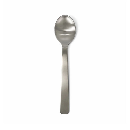 ACME brushed stainless steel oval table spoon on a white background