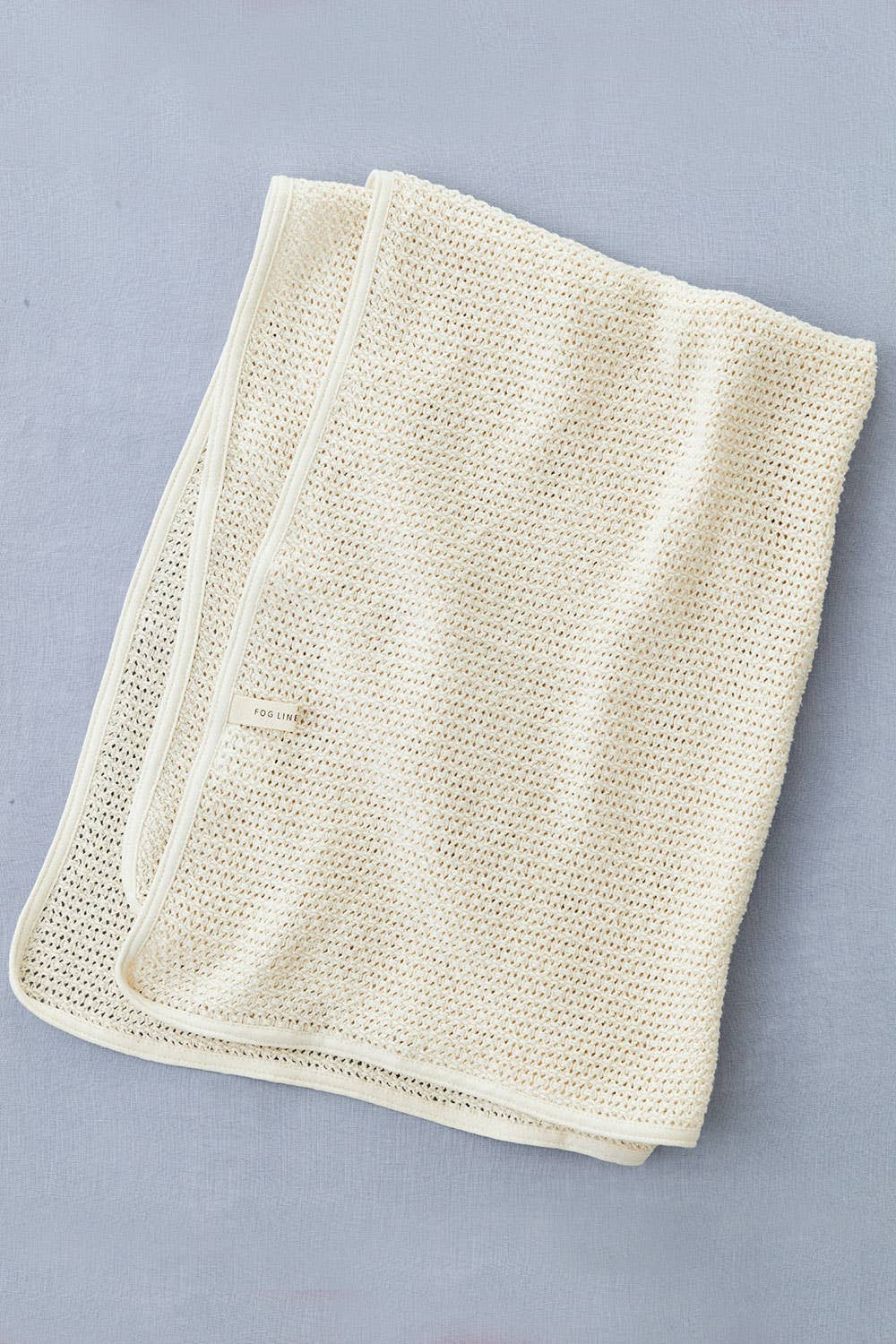 Fog Linen Work baby blanket showing the open mesh weave
